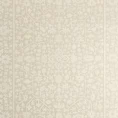 a white wallpaper with an intricate design on it