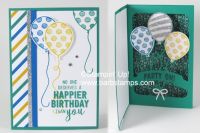 an open birthday card with balloons on the front and bottom, in blue and green