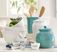 bowls and utensils are sitting on a table