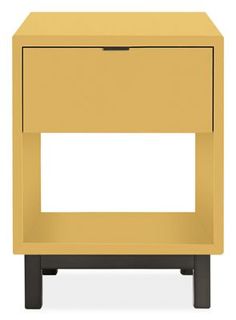 a small yellow nightstand with one drawer open