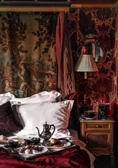 the bed is covered in red and gold wallpaper, with two teapots on it