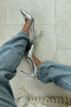 I'm obsessed with these silver heels. I think they give just the right amount of pop to any outfit. I paired them with these baggy jeans from Rag and Bone. Both items are linked on my LTK page if you want to check them out! | style, heels, silver, baggy jeans, denim, favorites, shoes, pumps, inspiration, fashion Metalic Heel Outfit, Metallic Pumps Outfit, Metallic Heels Outfit, Silver Pumps Outfit, Pumps Heels Outfit, Silver Boots Outfit, Silver Heels Outfit, Trending Shoes For Women, Silver Shoes Outfit