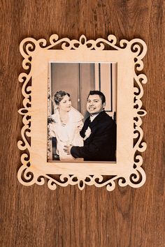 a wooden frame with an image of a man and woman