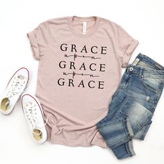 Out of his fullness we have all received grace in place of grace already given. - John 1:16 This T-shirt made at Naptime is an awesome way to spread the love of Jesus! This essential short sleeve t shirt fits like a well-loved favorite, featuring an irresistibly soft poly cotton blend and V neck. Lightweight and comfy womens fit, most ladies tell us they run "true to size". Lightweight and breathable tri-blend material, with a straight hem perfect for tucking or tieing. Designed by Michelle @ Naptime and cut and heat pressed in-store with premium heat transfer vinyl that’s designed to last. Material: 50% polyester, 37.5% cotton, 12.5% rayon,Features: Side-seamed. Retail fit. Womens sizing. Made to order product: Please allow 5-12 business days for delivery or in store pickup. Please note t Christian Jewelry Necklaces, John 1 16, T Shirt Fits, Grace Upon Grace, Essential Oil Roller Bottle, Fit Womens, Essential Oil Roller, Christian Jewelry, Shirt Fits