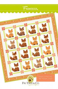 an orange and green quilt with foxes on it