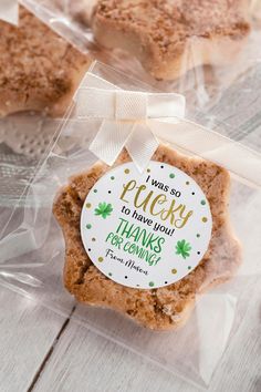 a cookie in a plastic bag with a thank you tag on it that says, a sweet thank you