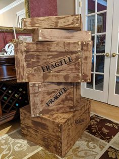 three wooden crates stacked on top of each other in front of a doorway with french doors