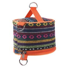 a multicolored bag with an orange handle on the front and bottom, hanging from a metal hook