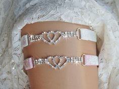 Double Heart Wedding Garter, Rhinestone Hearts Wedding Garter, Glam Hearts Garter, Double Heart Bridal Garter Set, Sparkle Keepsake Garter QUEEN SIZES AVAILABLE IN DROP DOWN MENU! Description: Keepsake wedding garter is 3.75 inches of rhinestone trim made of two rhinestone hearts entwined in the center of triple rows of rhinestone trim. Attached to 5/8 inch glitter on stretch elastic. It is shown in White AB and Pink AB. Can be purchased as a set of 2 for a keepsake and toss garter set. The picture set shows White AB and Pink AB. The set will be both in the same color unless you request different colors. I also have other colors glitter elastic available. White, Ivory, Light Pink,  Pink, Turquoise, Mint, Aqua, Royal Blue, Red, Black. Gold and Silver. Other colors can be requested. The Keep Royal Blue Garter, Heart Garter, Crystal Garter, Hearts Entwined, Prom Garters, Wedding Garter Blue, Keepsake Wedding, Blue Garter, Bridal Garters Set