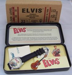 Fossil Elvis Presley watch set with tin and Guitar pin. This "Its Elvis In Person" watch set commemorates Elvis as he appeared in his first movie, Love me Tender, in 1956. This is a Sold out unworn, working limited edition collectible from Fossil.  The watch is a unisex three hand analog quartz wristwatch sized for men but popular as a modern over sized ladies watch. Case diameter is 36mm., Dark brown or black leather 18mm Fossil band. Mineral crystal.  Certificate of Authenticity, tags, tin, gu Love Me Tender, Concert Ticket, Guitar Pins, Watch Set, Fossil Watches, Three Hands, Over Sized, Concert Tickets, Vintage Band