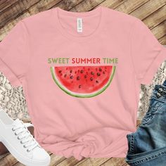 "Sweet summertime is a reason to celebrate! A cute watermelon print along with \"sweet summer time\" printed on the chest.  This classic unisex jersey short sleeve tee fits like a well-loved favorite. Soft cotton and quality print available in 4 colors!" Sweet Cotton Summer Top, Pink Fruit Print Tops For Summer, Sweet Pink Summer Tops, Sweet Pink Summer Top, Short Sleeve Tops For Spring And Summer Activities, Trendy Tops For Spring And Summer Activities, Sweet Fruit Print Summer Tops, Sweet Summer Tops With Fruit Print, Summer Strawberry Print Tops For The Beach