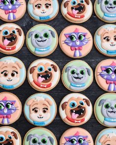 many decorated cookies with dogs and cats on them