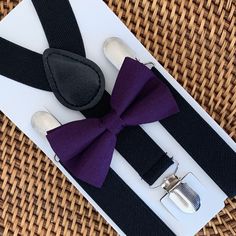 Your special guy will look so handsome when he shows up wearing this fine-looking plum bow tie and black suspenders! This bow tie & suspender set is a great choice for family photos, wedding, ring bearer outfit, birthday celebration or any other special occasion. ❤ **Please Specify** Bow Tie Only (w/ Clip or Neck Strap), Suspenders Only, or Bow Tie Only & Susp (Bow Tie and Suspenders) SUSPENDERS- One Pair of our Quality Suspenders BOW TIE - One Bow Tie on White Adjustable STRAP or Alliga Classic Black Bow Tie For Groom, Wedding Ring Bearer Outfit, Tie And Suspenders, Purple Bow Tie, Wedding Ring Bearer, Gentlemen Wear, Groomsmen Bowtie, Outfit Birthday, Black Suspenders