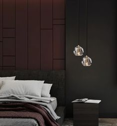 a bed with two lights hanging above it