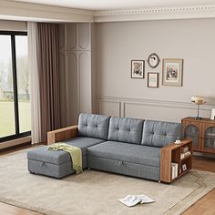 a living room filled with furniture and a large window