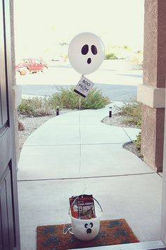 a balloon with a face is attached to a door