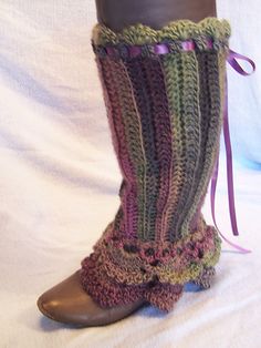 a pair of boots with crocheted laces on them