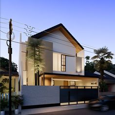 a car drives past a modern house at dusk