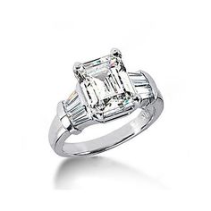 an emerald cut diamond ring with baguets