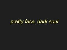 the words pretty face, dark soul written in yellow on a black background with an image of