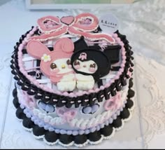 a cake decorated with minnie mouse and other items