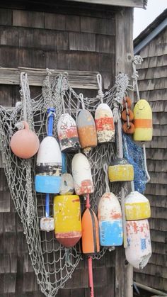 there are many buoys hanging on the wall