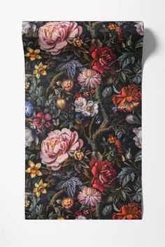 a black floral wallpaper with pink, red and yellow flowers on it's side