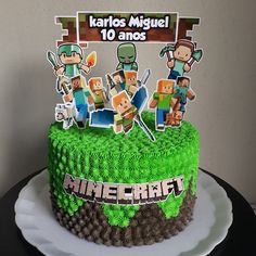 a birthday cake decorated with minecraft characters