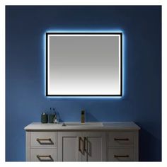 a bathroom vanity with a large mirror above it and drawers underneath the sink, in front of a blue wall