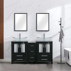 a bathroom with two sinks and mirrors on the wall