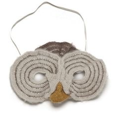 an owl mask is shown on a white background