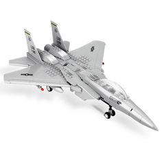 a model jet fighter plane on a white background