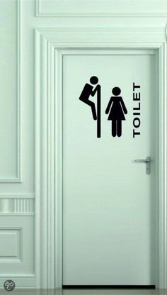 an open door with a sticker on it that says toilet and a man holding a woman's hand