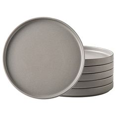 stack of grey plates on white background