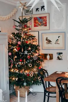 a decorated christmas tree in a dining room