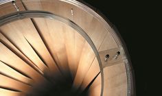 a close up view of the inside of a large metal object with light coming from it