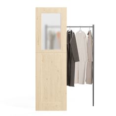 an open wooden door with clothes hanging on the hangers next to it and a white background