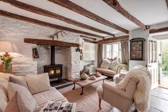 a living room filled with furniture and a fire place