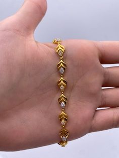 A Beautiful & Dainty 22ct / 22K Yellow Gold & Cubic Zirconia (CZ) Fancy Bracelet Metal : 22K Gold 916 Gold Weight : 9.2 GramsLength : 7 inch Width : 6.0 mm Packaging : Elegant Box Shipping Free in UK Shipping World Wide : See Policy Payment : PayPal, Credit Card, Bank Transfer Returns Policy : 14 Days Hassle Free Returns for 100% Refund To try this item Or View More from our collections Please Visit Our Showroom at North west London . Bracelets Gold Design For Women, Gold Bracelets Design For Women, Gold Bracelet Simple Design, Good Bracelets For Women, Gold Bracelet For Women Design, Elegant Gold Bracelet Simple, Braslate Design For Women, Women Bracelets Gold Designs, Bracelets Designs For Women