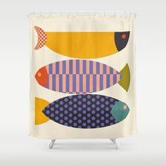 a shower curtain with colorful fish on the front and back sides, in different colors