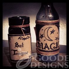 two jars with labels on them sitting on a table next to each other, one has a bat and the other has a crescent