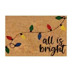 a door mat that says, all is bright with christmas lights hanging from the side