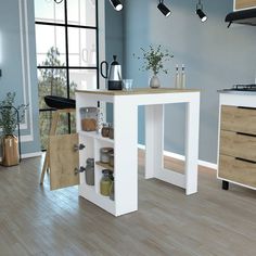 a kitchen with blue walls and wooden floors