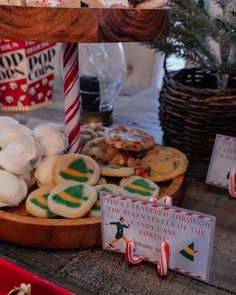 christmas cookies and candy are on display in front of other holiday treats, including marshmallows