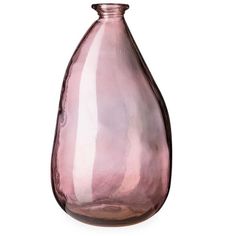 a pink glass vase sitting on top of a white table