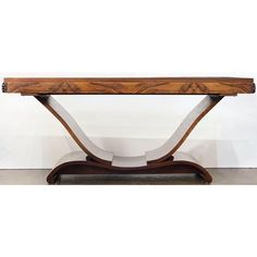 an art deco console table in walnut and white