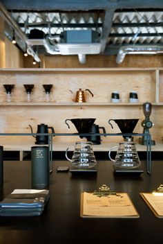 some coffee cups are sitting on a table