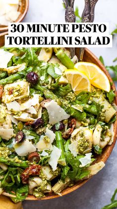 a salad with broccoli, olives, and other vegetables in a bowl