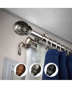 the curtain rod has three different types of knobs on it and is hanging from the ceiling