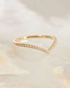 a gold ring with diamonds on it